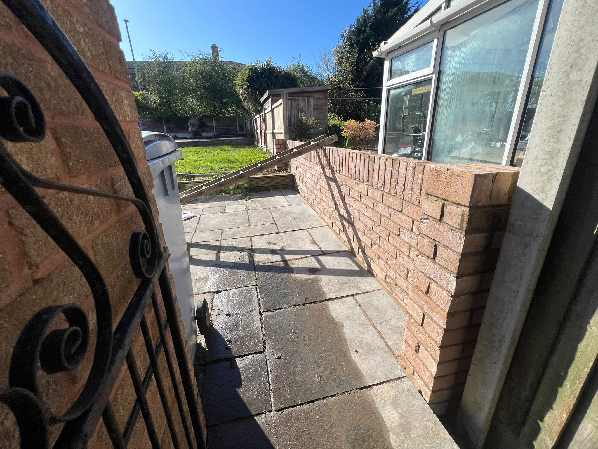Patio access route beside newly completed brick wall